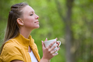 woman drinking coffee enjoying the morning